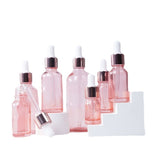 Customized High Quality 5ML, 10ML, 20ML, 25ML, 30ML, 50ML and 100ML Pink Glass Dropper Bottles